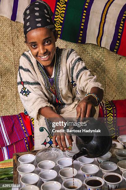 young african girl preparing coffee, ethiopia. east africa - ethiopian coffee ceremony imagens e fotografias de stock