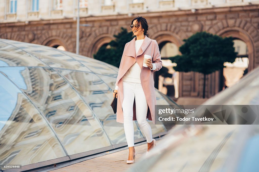 Beautiful elegant woman drinking coffee