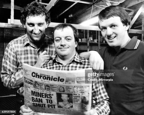 The stars of hit television programme Auf Wiedersehen, Pet - left to right - Jimmy Nail, Tim Healy and Kevin Whatley reading a copy of the Newcastle...