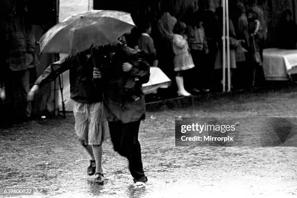 Severe stormy weather with torrential rain and flooding at the annual Summer Exhibition on the Newcastle Town Moor on August 1, 1980.