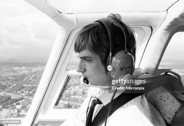 Mike Oldfield, musician and composer, pilots helicopter from Blackfriars, London to his home in Denham, Bucks, after receiving the Freedom of the...