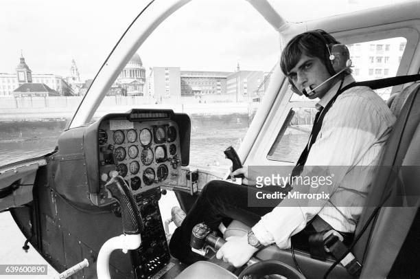 Mike Oldfield, musician and composer, pilots helicopter from Blackfriars, London to his home in Denham, Bucks, after receiving the Freedom of the...