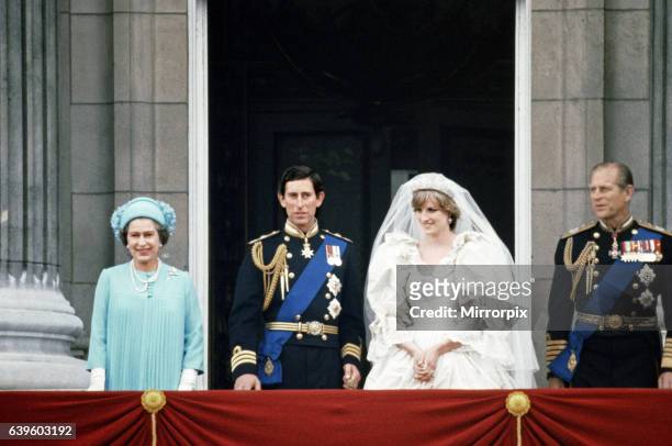 Prince Charles and Lady Diana Spencer with Queen Elizabeth II and Prince Philip on the balcony at Buckingham Palace after their marriage ceremony at...