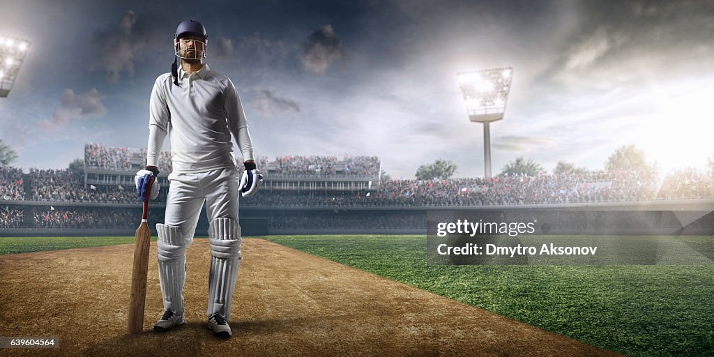 Cricket player batsman on the stadium