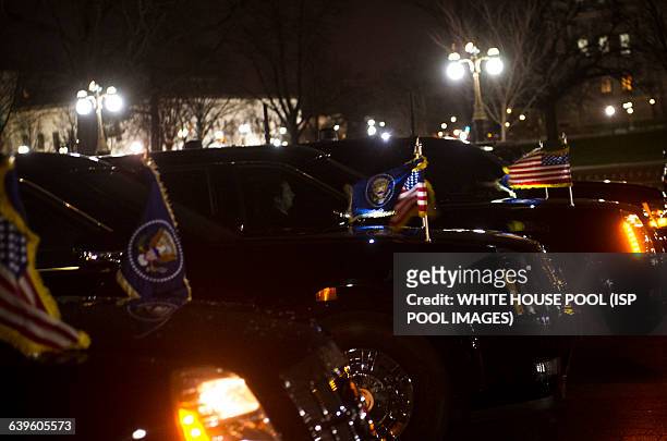 Cars in the presidential motorcade are parked outside the U.S. Capitol as U.S. President Barack Obama makes his exit following his State of the Union...
