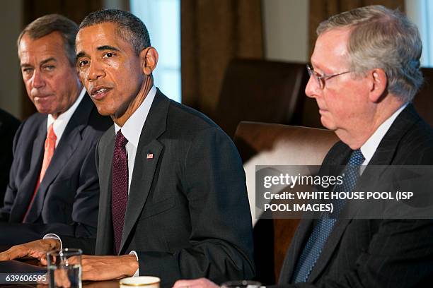 President Barack Obama, center, meets with Speaker of the House John Boehner, left, and Senate Majority leader Mitch McConnell, right, during a...