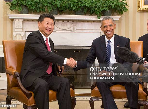 China's President XI Jinping and United States President Barack Obama hold a meeting during an official State Visit at the White House in Washington,...