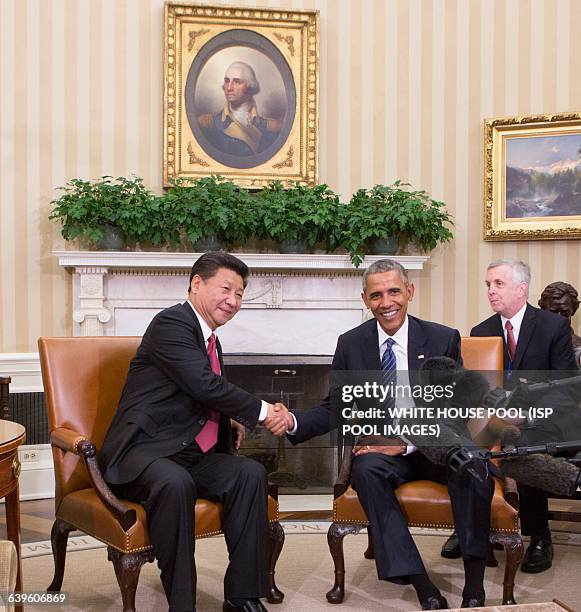 China's President XI Jinping and United States President Barack Obama hold a meeting during an official State Visit at the White House in Washington,...