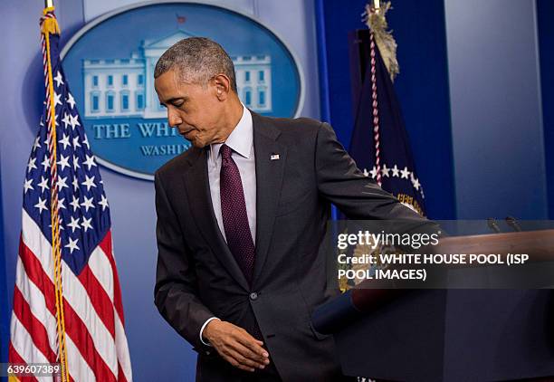 President Barack Obama leaves the podium after speaking on the shooting at Oregon's Umpqua Community College, at the White House in Washington, D.C....