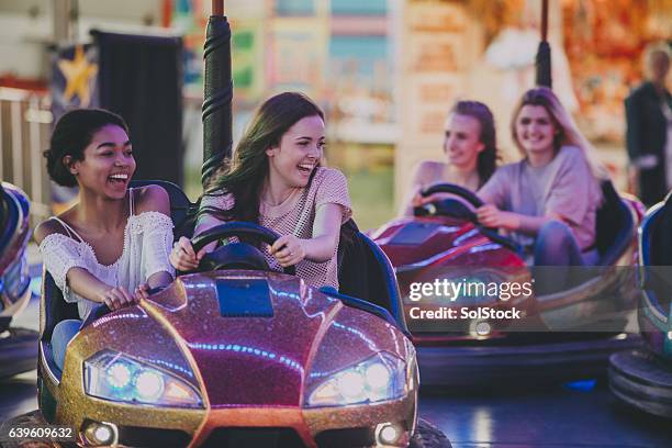 teen girls driving bumper cars - tyne and wear stock pictures, royalty-free photos & images