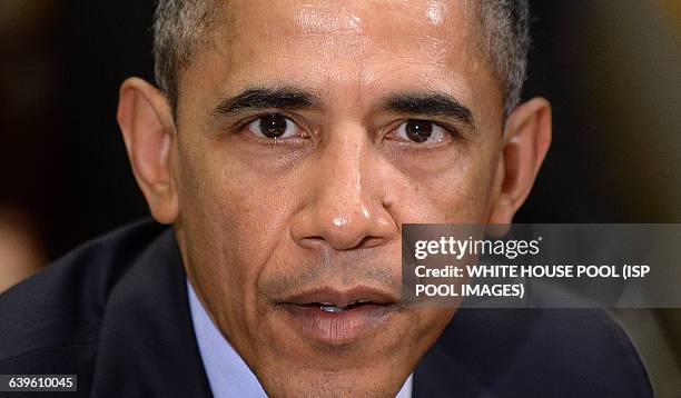 President Barack Obama meets with the Council of the Great City Schools Leadership in the Roosevelt Room of the White House March 16, 2015 in...