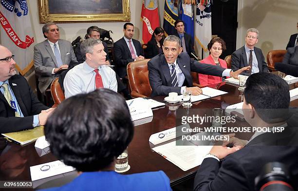 President Barack Obama meets with the Council of the Great City Schools Leadership in the Roosevelt Room of the White House March 16, 2015 in...