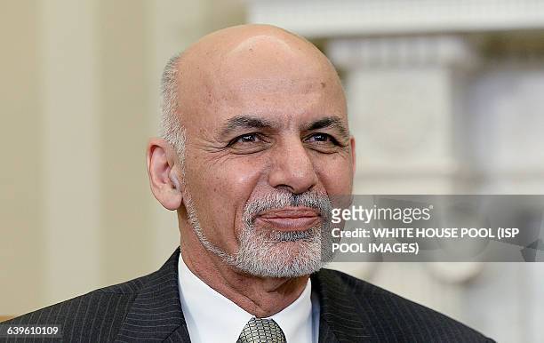 Afghan President Ghani looks on during a restricted bilateral meeting with President Barack Obama in the Oval Office of the White House March 24,...