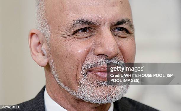 Afghan President Ghani looks on during a restricted bilateral meeting with President Barack Obama in the Oval Office of the White House March 24,...