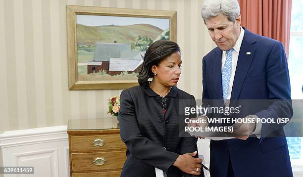 Secretary of State John Kerry speaks with National Security Adviser Susan Rice during a bilateral meeting in the Oval Office between President Barack...