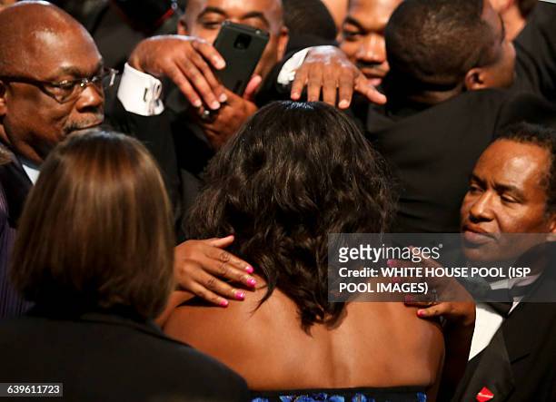First Lady Michelle Obama greets the crowd after US President Barack Obama delivered remarks at the Congressional Black Caucus Foundation's 45th...