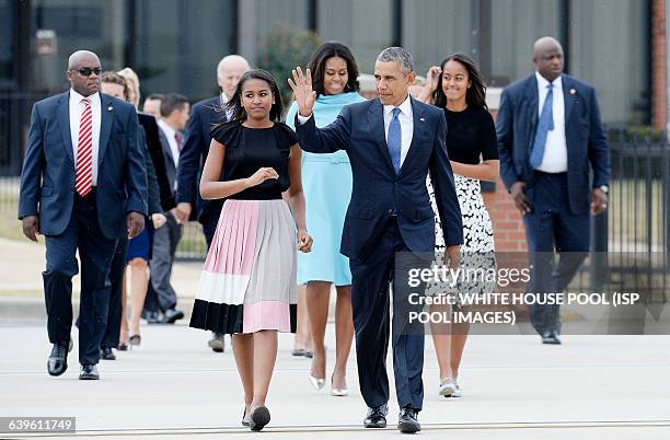 President Barack Obama, First Lady Michelle Obama and daughters Malia and Sasha arrive to greet His Holiness Pope Francis on his arrival at Joint...