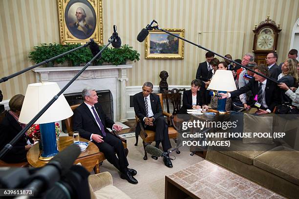 President Barack Obama prepares to speak to the media before a bilateral meeting with German President Joachim Gauck in the Oval Office of the White...