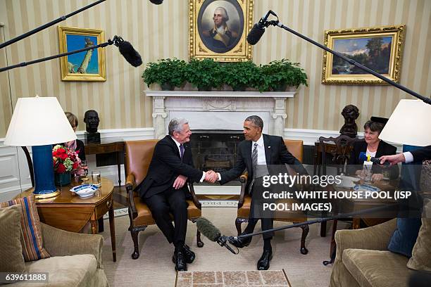 President Barack Obama shakes hands with German President Joachim Gauck before the two held a bilateral meeting in the Oval Office of the White House...