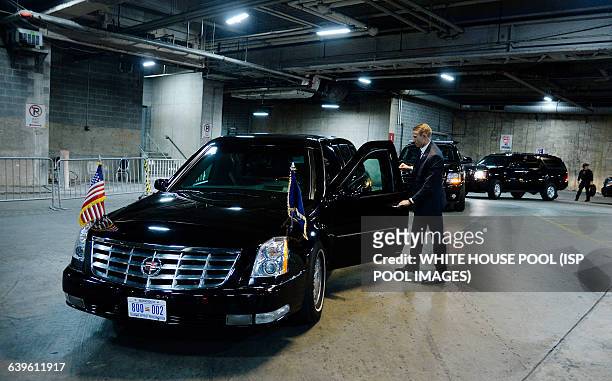 Secret Service Agent stands still next to U.S. President Barack Obama's car named "the beast" in a underground parking at the Congressional Hispanic...
