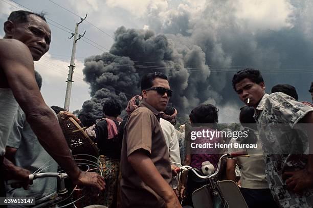 Civilians fleeing a neighbourhood in Saigon which has been hit by Vietcong rockets.