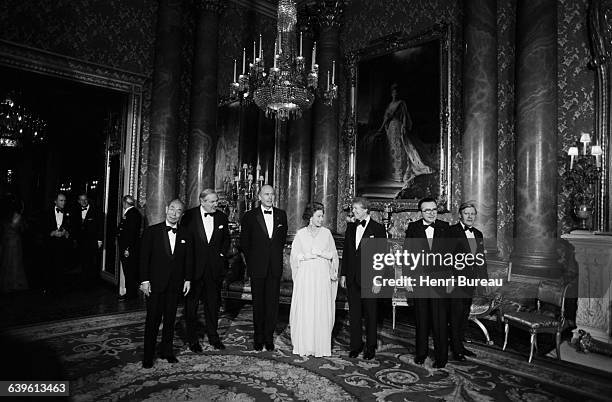 The Queen of England hosts a dinner at Buckingham Palace in honor of the of the seven heads of government who met in London to discuss the...