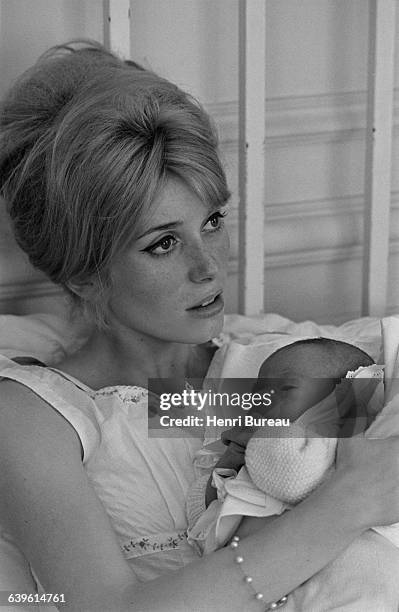French actress Catherine Deneuve with her son Christian Vadim just a few days after his birth.