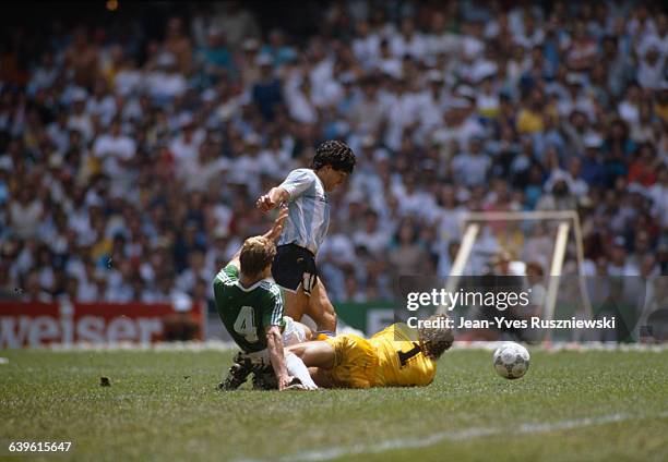 Final of the 1986 FIFA World Cup in the Azteca stadium. Argentina vs Germany. Argentina won 3-2. Argentina's Diego Maradona is tackled by Germany's...