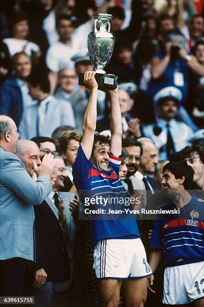 Michel Platini, captain of the French soccer team, holds the European Cup trophy after his team defeated Spain 2-0 in the final of the 1984 UEFA Euro.