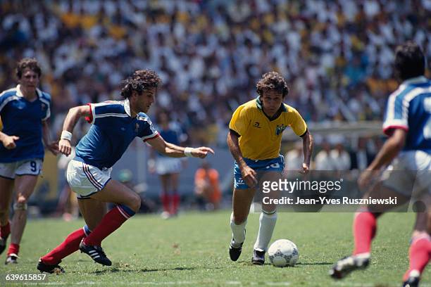 France's Patrick Battiston and Brazil's Zico face off during the quarter-finals of the 1986 FIFA World Cup. France defeated Brazil 4-3 after...