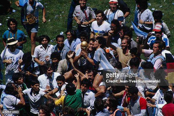 Diego Maradona of Argentina celebrates with fans and team-mates after the 1986 FIFA World Cup final against West Germany, in the Azteca stadium....