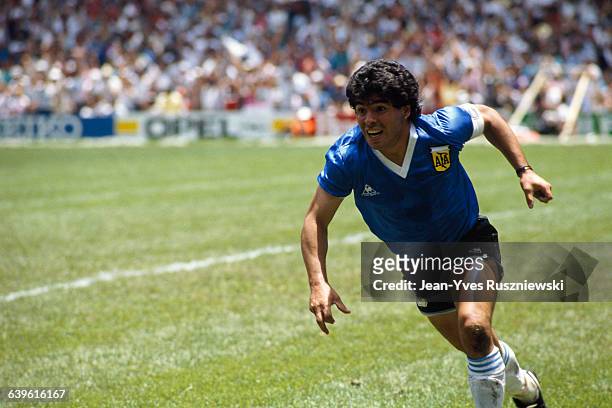 Diego Maradona from Argentina celebrates after scoring his second goal against England in a quarterfinal match of the 1986 FIFA World Cup.