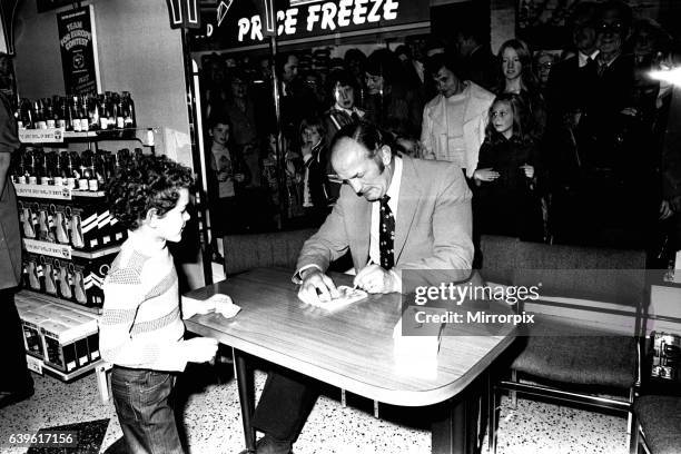 Boxer Henry Cooper visited British Home Stores in Newcastle on 22nd October 1980 to sign autographs and promote Brut aftershave.