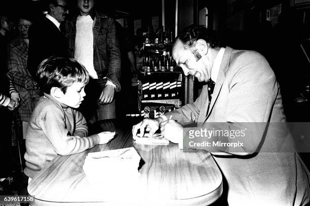 Boxer Henry Cooper visited British Home Stores in Newcastle on 22nd October 1980 to sign autographs and promote Brut aftershave.