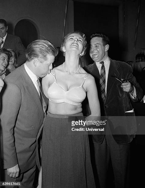French TV celebrity Jacques Angelvin shows the new inflatable push-up bra for the first time in France. Angelvin was later arrested for drug...