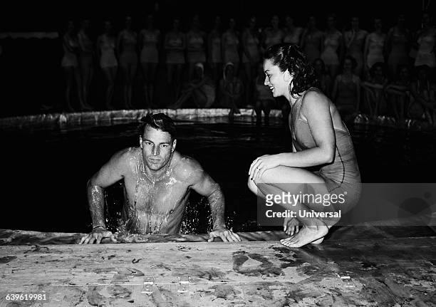 Buster Crabbe and Vicky Draves during an aquatic show.