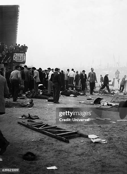 The Mercedes driven by Pierre Levegh strikes the rear of the Austin Healey driven by Lance Macklin. After ramming into the embankment and exploding,...