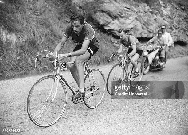 Cyclist Fausto Coppi leads Jean Robic in the tenth stage of the 1952 Tour de France. | Location: Between Lausanne, Switzerland and l' Alpe-d'Huez,...