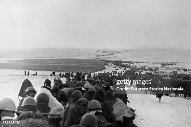 Italian Troops retreating at Scelyakino. In the picture, the stream of marching soldiers, seen from behind. Photograph taken by Lieutenant Roberto...