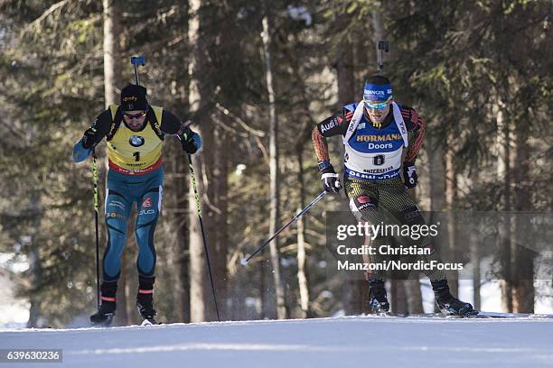 Martin Fourcade of France and Eric Lesser of Germany compete during the 15 km men's Mass Start on January 22, 2017 in Antholz-Anterselva, Italy.