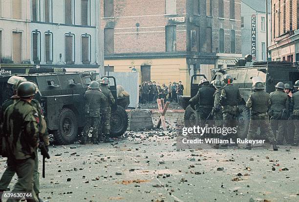 Youths confront British soldiers minutes before paratroopers opened fire killing 14 civilians on what became known as Bloody Sunday. The standoff is...