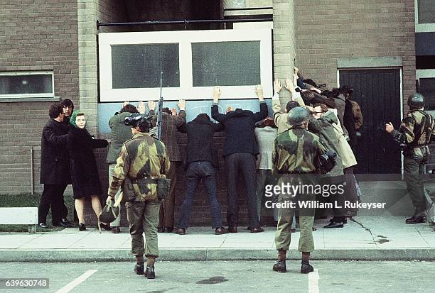 British troops arrest civilians on Rossville St, Londonderry during a civil rights march. The day went on to become known as Bloody Sunday as British...