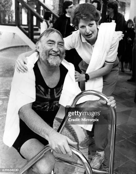 Leisure complex attendant Phillipa Seccombe helps David Bellamy out of the pool at the Eden Arms, Rushyford on 29th November 1986, after his opening...