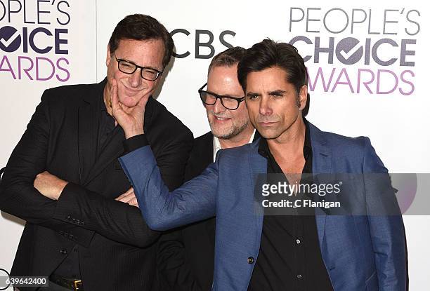 Actors Bob Saget, Dave Coulier and John Stamos pose in the press room during the People's Choice Awards 2017 at Microsoft Theater on January 18, 2017...