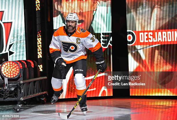 Eric Desjardins of the Philadelphia Flyers Alumni skates onto the ice surface during the pregame introductions prior to playing the Pittsburgh...