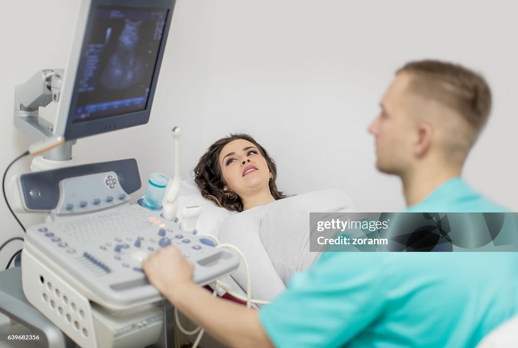 Pregnant woman having ultrasound