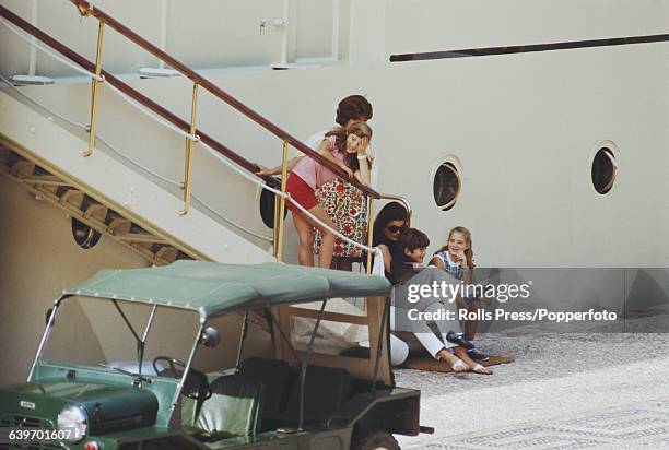 Former First Lady of the United States, Jacqueline Kennedy Onassis pictured with her children, John Jr and Caroline on the day before her wedding to...