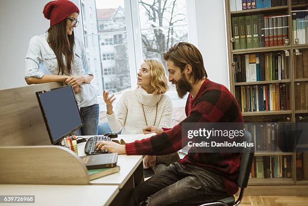 group of students doing some research togheter - togheter stock pictures, royalty-free photos & images