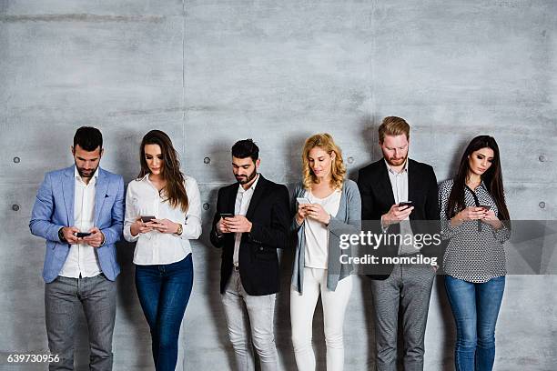 group of people surfing the net - people in a line stock pictures, royalty-free photos & images