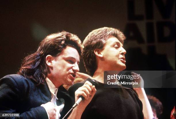 Paul McCartney singer musician and Bono of U2 at the Live aid Concert Wembley .